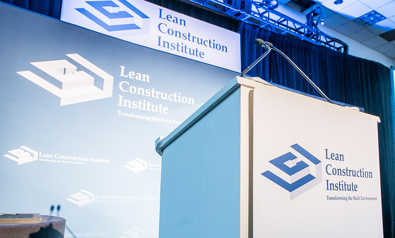 lean construction institute stage with podium lci logo in foreground and background